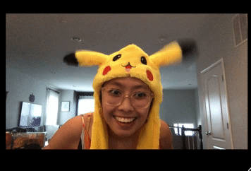 Michelle is wearing a pikachu hat whose ears flop about.